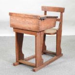 An early 20th century pine school desk