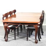 A 1920's mahogany wind-out extending dining table, on cabriole legs