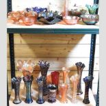 Two shelves of carnival and coloured glass,