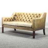 A mid 20th century green leather upholstered button back sofa,