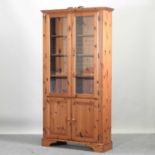 A modern pine cabinet bookcase,