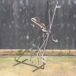 A black painted wrought iron weather vane,