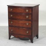 An early 20th century mahogany bow front chest,