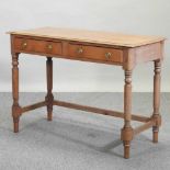 An antique pine side table,