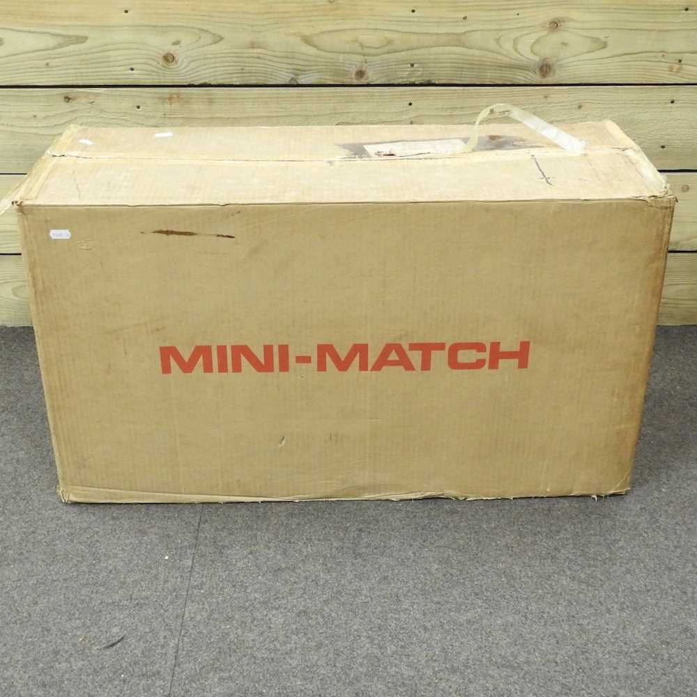 A box of unused Mini Match toy games,