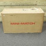 A box of unused Mini Match toy games,
