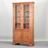 A modern pine cabinet bookcase,