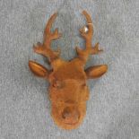 A rusted metal model of a deer head