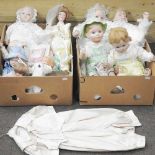 Two boxes of modern bisque dolls,