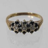 A 9 carat gold sapphire and diamond triple cluster ring