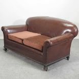 A 1920's brown upholstered sofa,