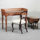 A Victorian oak writing table,