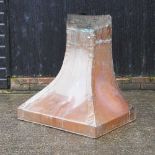 A copper fire hood,