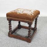 An early 20th century oak footstool,