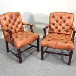 A pair of leather upholstered button back open armchairs,