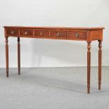 A mahogany five drawer hall table,