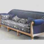 A large gilt framed blue upholstered sofa,