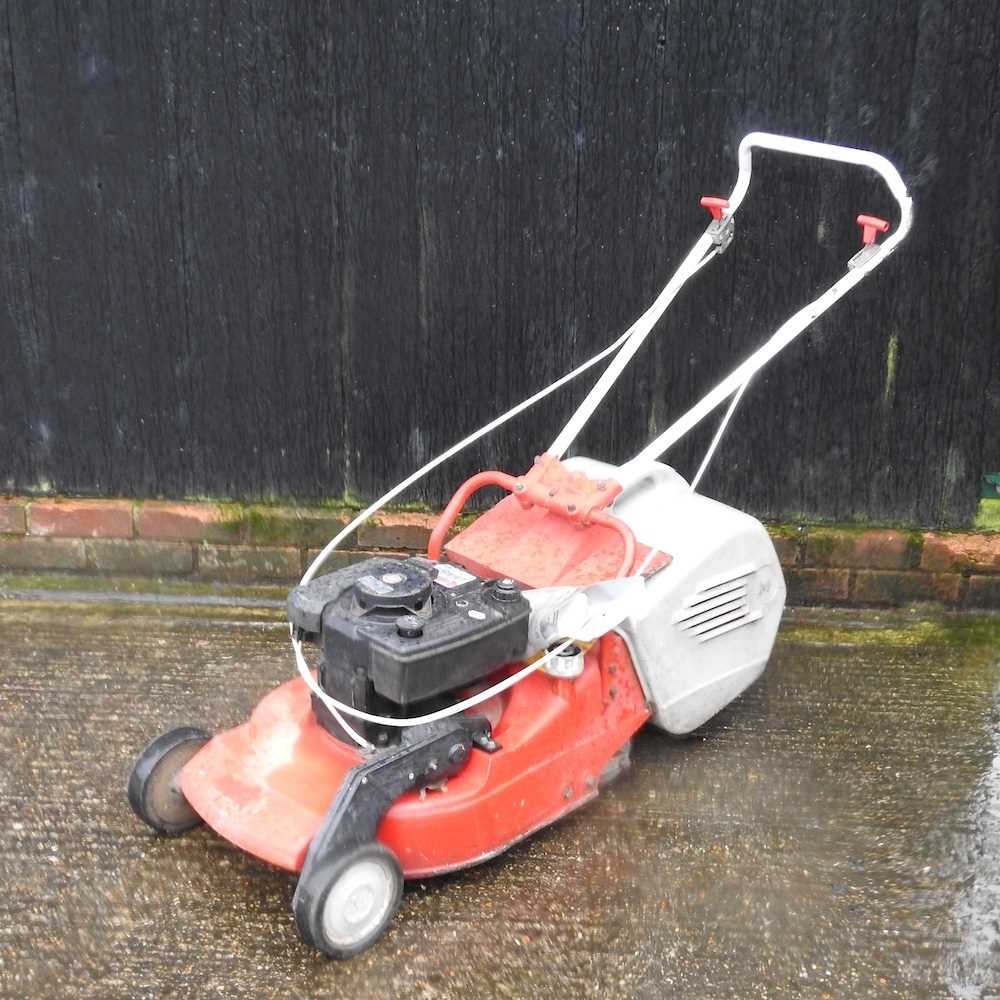 A petrol lawnmower,