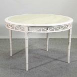 A cream painted marble top dining table,