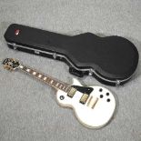 An Epiphone Les Paul custom electric guitar,
