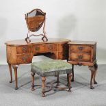 A 1930's walnut kidney shaped dressing table,