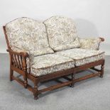 An Ercol floral upholstered sofa,