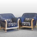 A pair of gilt framed and blue upholstered armchairs,