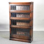An early 20th century Globe Wernicke graduated four tier glazed sectional bookcase,