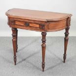 A 20th century hardwood and crossbanded hall table,