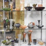 Three shelves of carnival and coloured glass