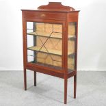 An Edwardian mahogany and inlaid glazed display cabinet,