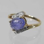 A 9 carat gold diamond crossover cabochon dress ring