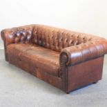 A modern brown leather upholstered button back chesterfield sofa,