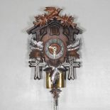 An early 20th century carved wooden cuckoo clock