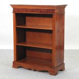 A reproduction mahogany dwarf open bookcase