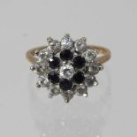 A 9 carat gold sapphire and diamond cluster ring