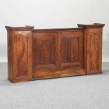 An antique fruitwood cabinet,