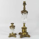 An ornate early 20th century gilt metal and glass table lamp,