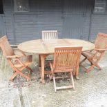 A teak extending garden table,