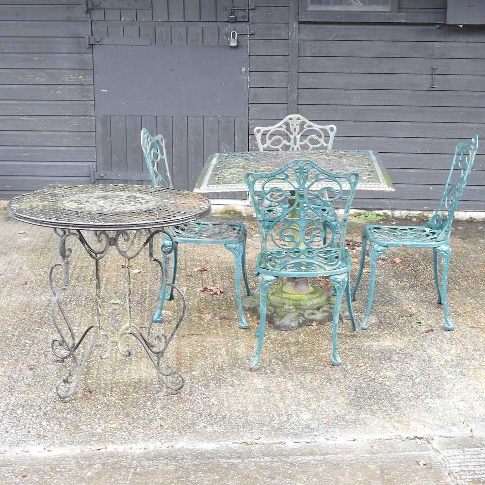 A green painted cast iron garden table,