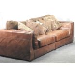 A modern brown leather upholstered sofa,