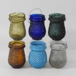 A collection of six various early 20th century coloured glass tea lights