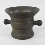 An antique turned bronze mortar