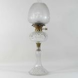 An early 20th century cut glass oil lamp