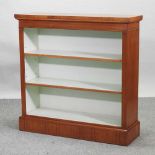 A hand made walnut and crossbanded dwarf open bookcase