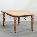 A Victorian walnut wind-out dining table