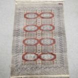 A bokhara woollen rug,