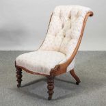 A Victorian walnut salon chair,