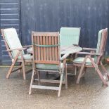 A teak circular garden table,