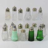 A collection of early 20th century glass sugar sifters,
